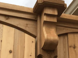Wooden pergola with curved decorative brackets and timber beam construction